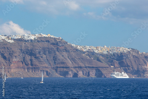 Santorini - The cliffs of calera with the cruises withe the Thera and Firostefani in the background. photo