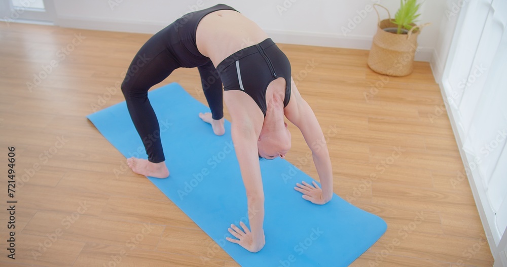 Fototapeta premium pretty young woman do meditation practice yoga for peace doing stretching exercise, fitness or spiritual health. Balance, mindfulness and wellness and relax at home, breathing and mindset training