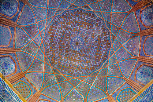 Beautiful traditional ceiling, mosaic of golden, blue and orange colors in Shah Jahan Mosque in Thatta, Pakistan. Also known as Jamia Masjid of Thatta. 