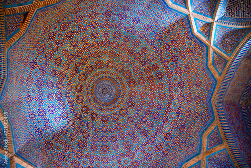 Magnificent traditional ceiling, kaleidoscope of golden, blue and orange colors in Shah Jahan Mosque in Thatta, Pakistan. Also known as Jamia Masjid of Thatta.  photo