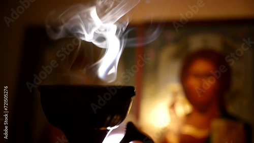 Streaming smoke from a censer in a church. Slow motion