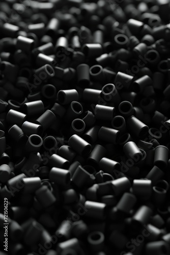 A close-up view of a pile of black beads. Perfect for jewelry making or crafting projects