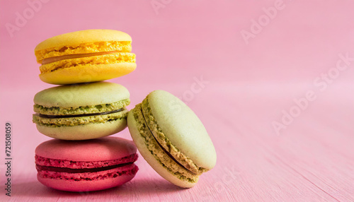 Macaroons stacked on pink background, copyspace on a side