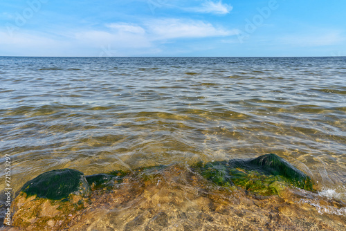 Fototapeta Naklejka Na Ścianę i Meble -  Surface of a rock on the beach, splash sea waves, baltic sea in Poland	