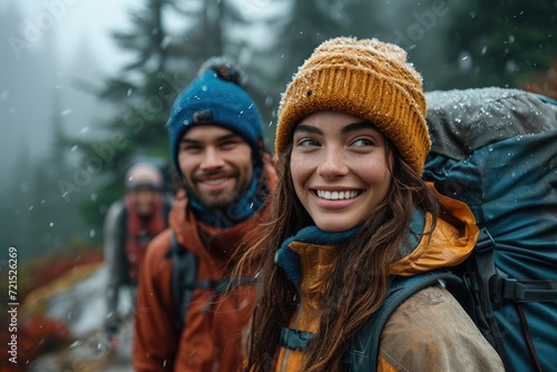 A joyful group of bundled up individuals, with rosy cheeks and beaming smiles, standing in the snowy winter wonderland wearing cozy jackets, scarves, and headgear, including a woman in a charming bon