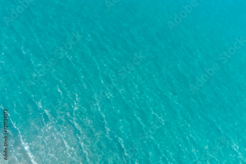 Calm clear blue sea water background. Blue azure sea water texture. © Abdul