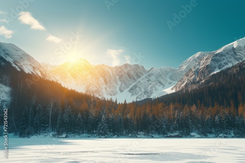 The setting sun shines on the snow capped mountain and trees © Adobe Contributor