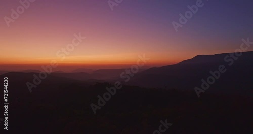 Wallpaper Mural aerial view The sky is beautifully colored at twilight over the rolling mountain ranges..Mountainous Autumn Landscape with Vibrant Foliage and Scenic Views.sweet twilight sky above the mountain range Torontodigital.ca