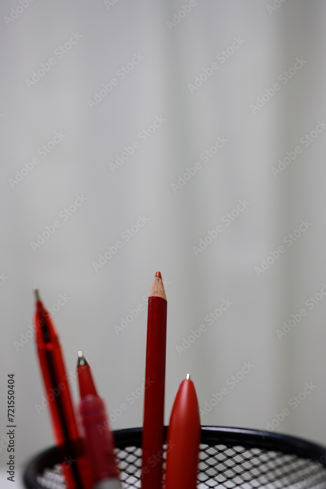 Red pencil on white background