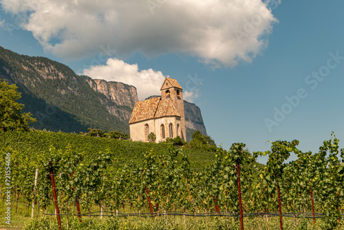 church in the vineyard with mountains and clouds
