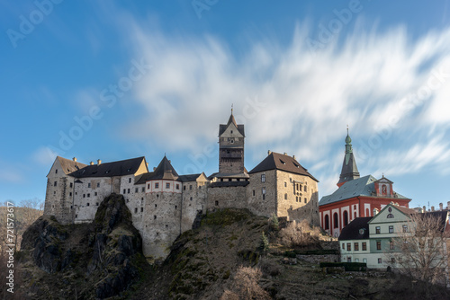 Loket castle on a hill with a clock tower