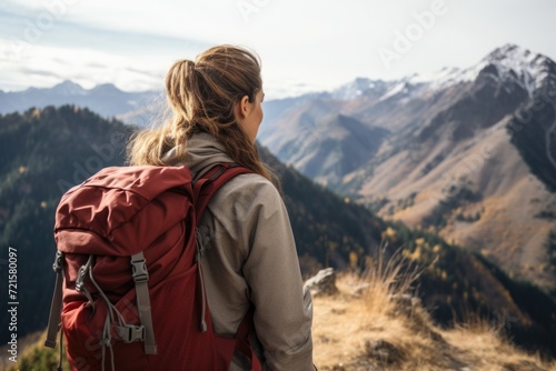 Serene Adventure: Female Hiker on Mountain Trek, Enjoying the Scenic View and Nature's Beauty