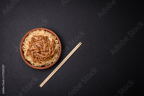 Delicious Asian cuisine dish with rice noodles, peppers, mushrooms and spices