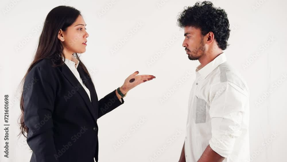 business women scolding to a employ holding notebook facing man with serious expression isolated on white background business women scolding to a employ holding notebook facing man with serious expression isolated on white background