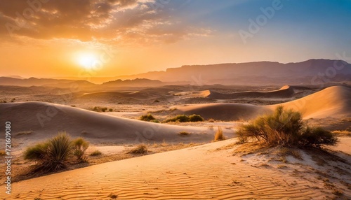 sun sets over the sand dunes