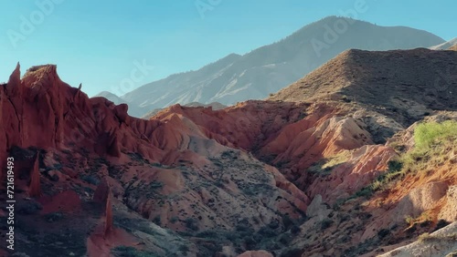 A fabulous canyon in Central Asia. Scenic view of a beautiful textured multi-layered canyon. Mountain ranges in a fabulous canyon at sunset near Lake Issyk-Kul in Karakol. 4K