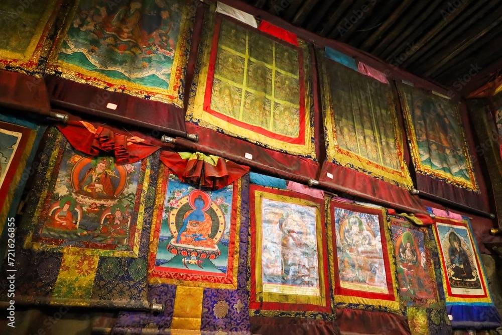 Explore the historic Thangka collections at Chorten Nyima Monastery in Kamba county, Shigatse, Tibet. Vibrant colors and spiritual essence capture the rich cultural heritage of the region.