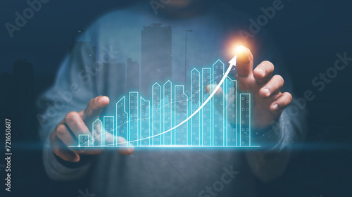 Real estate investment marketing analysis, Concept of business prosperity and asset management, Man pointing graphic of analyzed graph of business growth, Planning to increase profits of business.