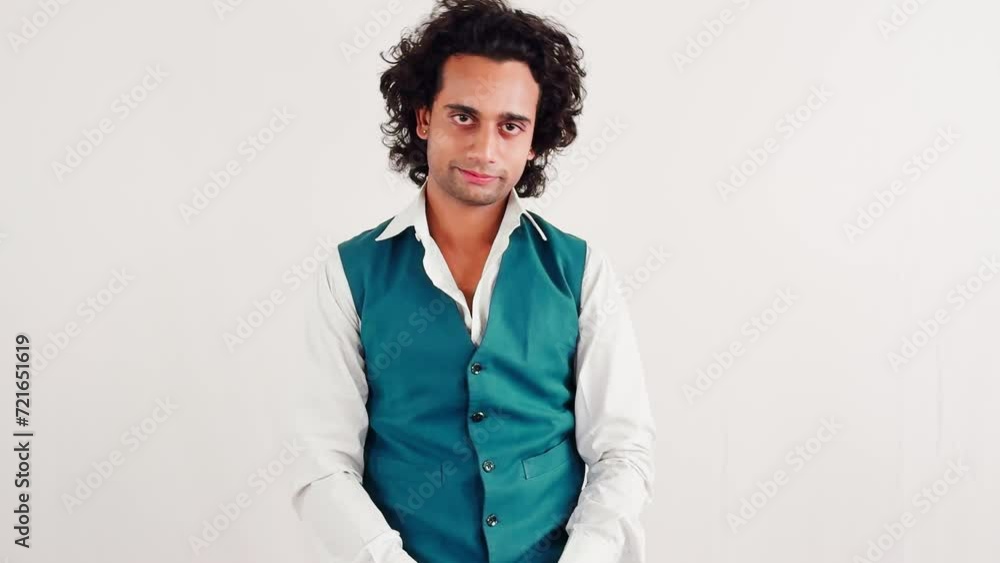 Confident young man talking posing against a white background Confident young man talking posing against a white background