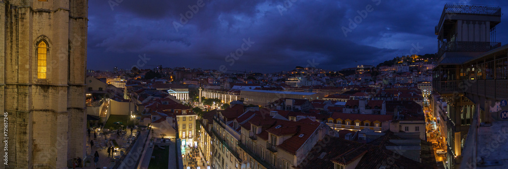 Panorama of ruin of Convento do Carmo during nighttime with view over the city centre of portuguese capital and Parca Dom Pedro IV, Lisbon, Portugal