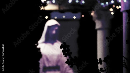 young grandmother sits by the fireplace drinking tea