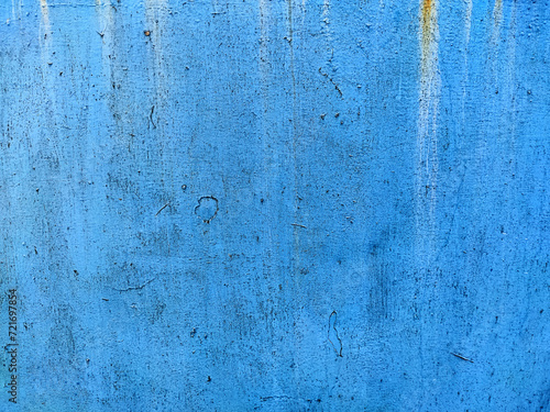 Rusty metal panel with cracked blue paint, corroded grunge metal background