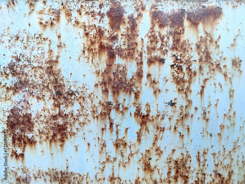 Rusty metal background with streaks of rust. Corroded metal background. Rust stains. Rusty corrosion.