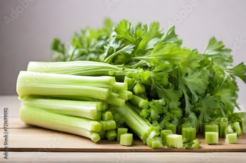Fresh green celery on a wooden table isolated on white background