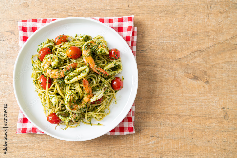 Spaghetti with seafood in homemade pesto sauce Spaghetti with seafood in homemade pesto sauce