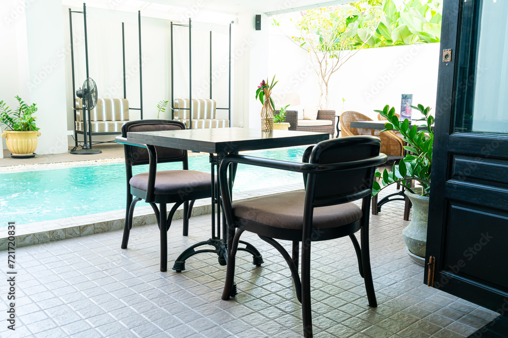 table and chair around swimming pool