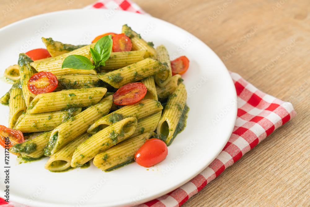 penne pasta with pesto sauce and tomatoes