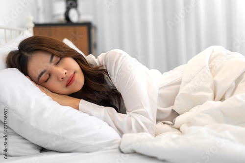 Portrait of cheerful beautiful pretty asian woman clean fresh healthy white skin sleeping and close eye.Girl felling relaxing and enjoy time on the bed at home.asia beauty