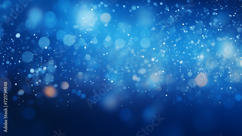 Blue glow particle abstract background with bokeh effect