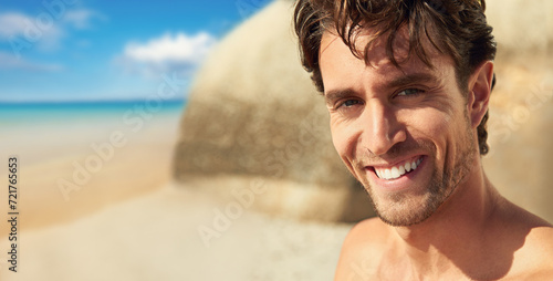 Man, smile and portrait at the sea on a holiday and vacation outdoor with travel on adventure. Happy, beach and male person in Bali by the ocean with confidence and freedom from trip and journey