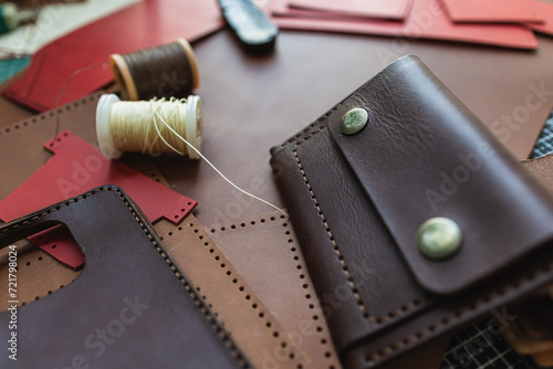 Genuine vegetable tanned leather working leather wallet on leather background