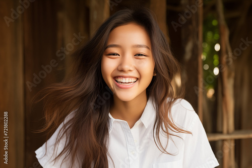 Asian girl smile radiating joy  with a friendly demeanor dons. A001 photo