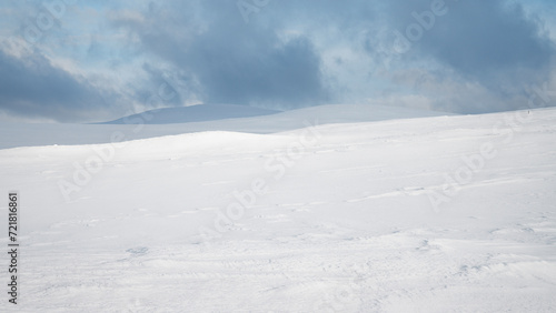 Empty fell landscape on a cold winter day with beautiful texture on the snow