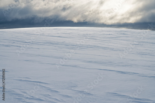 Empty fell landscape on a cold winter day with beautiful texture on the snow