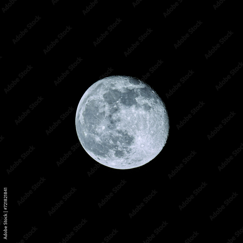 Obraz premium a waning full moon in the black night sky