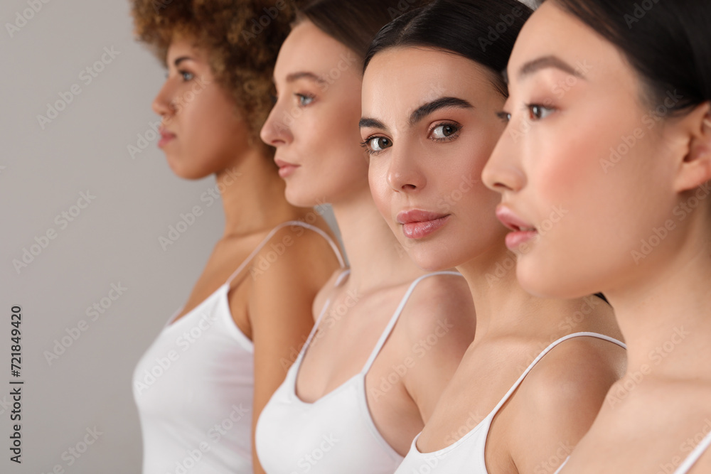 Beautiful young women with healthy skin on gray background Beautiful young women with healthy skin on gray background
