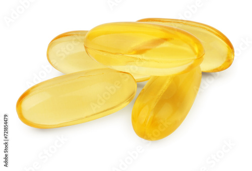 Many yellow vitamin capsules isolated on white