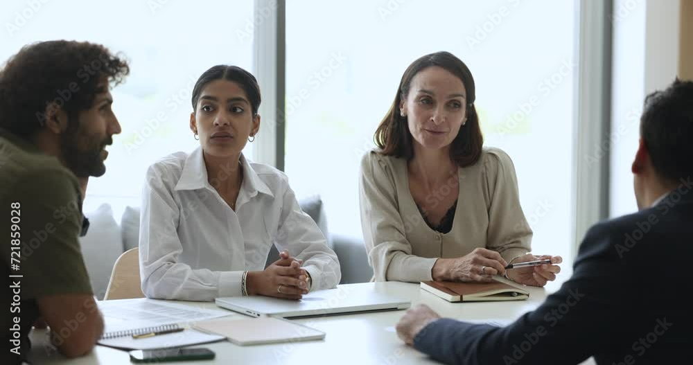 Diverse HR team and job candidate talking at interview, speaking at meeting table. Multiethnic business colleagues, partners discussing teamwork, partnership, collaboration terms Diverse HR team and job candidate talking at interview, speaking at meeting table. Multiethnic business colleagues, partners discussing teamwork, partnership, collaboration terms