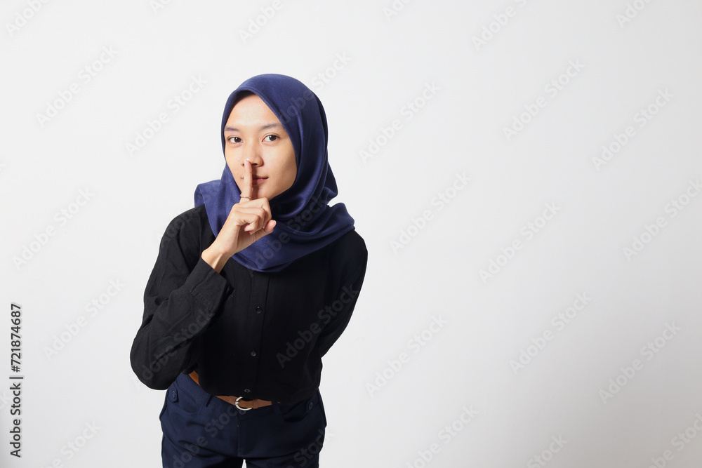 Portrait of excited Asian hijab woman in casual suit screaming announcement and whispering gossip. Businesswoman concept. Isolated image on white background Portrait of excited Asian hijab woman in casual suit screaming announcement and whispering gossip. Businesswoman concept. Isolated image on white background