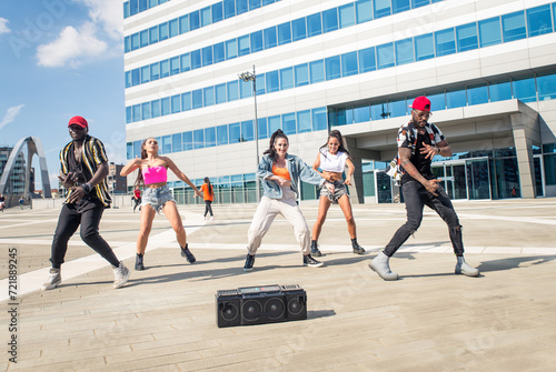 Group of hip hop dancers permorming their dance. photo