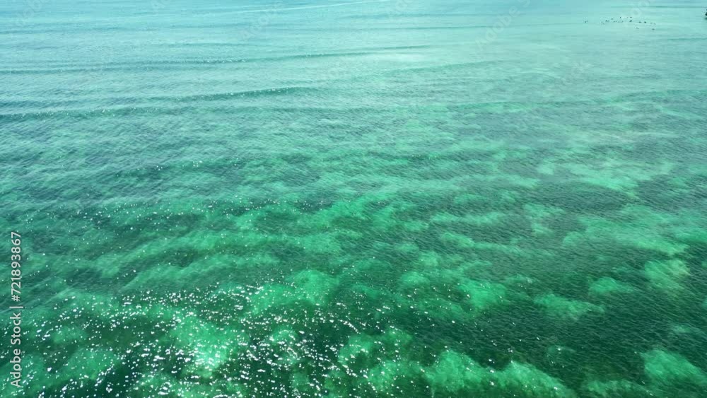 Flying a drone over the turquoise sea or ocean. Aerial view. Flying a drone over the turquoise sea or ocean. Aerial view.