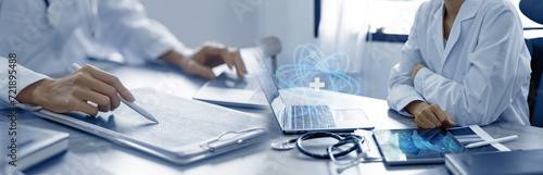 Medicine doctor touching laptop with  digital healthcare and network connection and hologram modern virtual screen interface icons, Medical technology and futuristic concept.