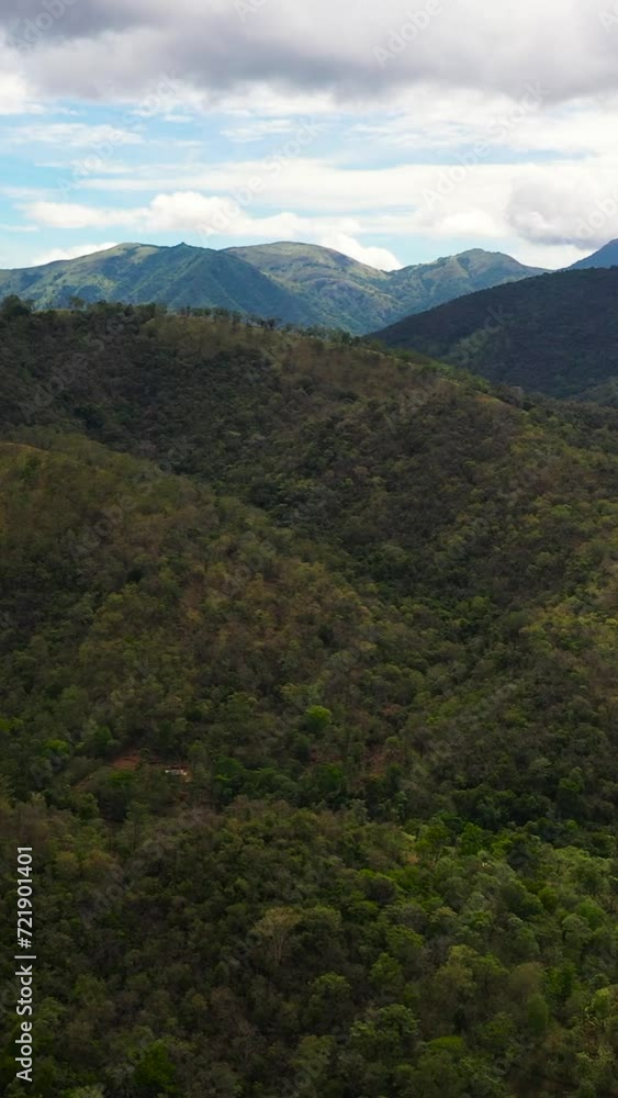 Mountains covered rainforest, trees and blue sky with clouds. Sri Lanka. Mountains covered rainforest, trees and blue sky with clouds. Sri Lanka.
