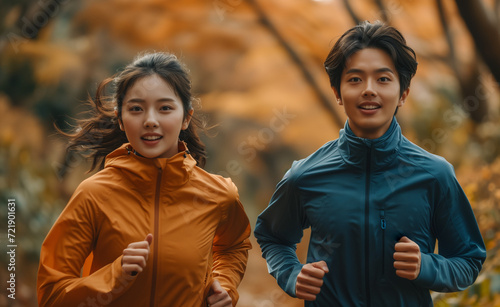 Japanese people running a marathon in a park in autumn