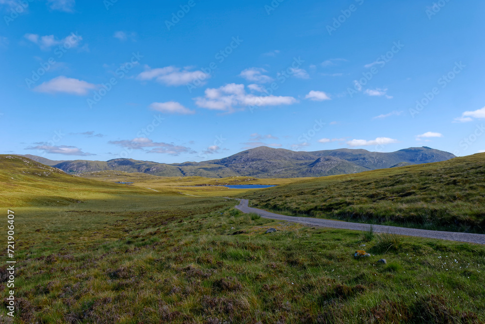 A view of the North Lochs in the Central area of the Isle of Lewis. with a winding road running through the Remote Region.