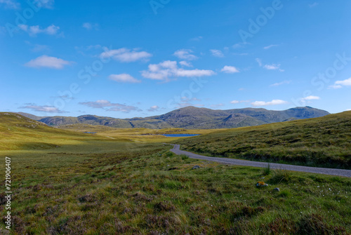 A view of the North Lochs in the Central area of the Isle of Lewis. with a winding road running through the Remote Region.